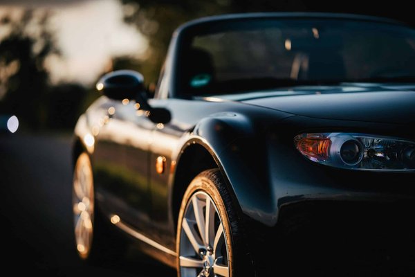 Can Installing a Wind Deflector Improve the Top-Down Experience in a Mazda MX-5 Miata?